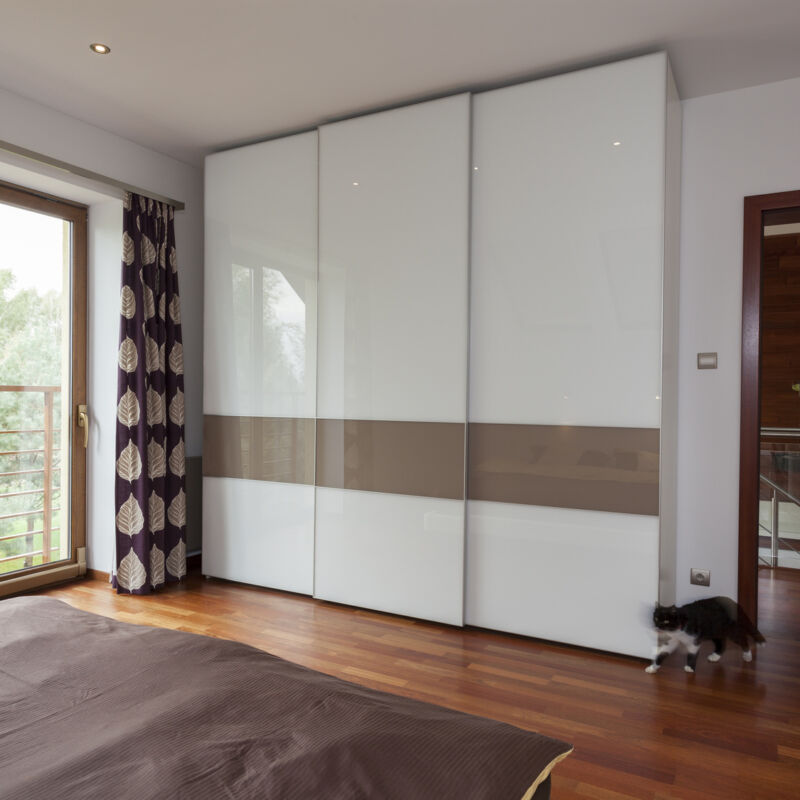Contemporary bedroom with balcony and huge wardrobe