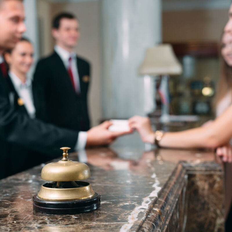 Picture of guests getting key card in hotel